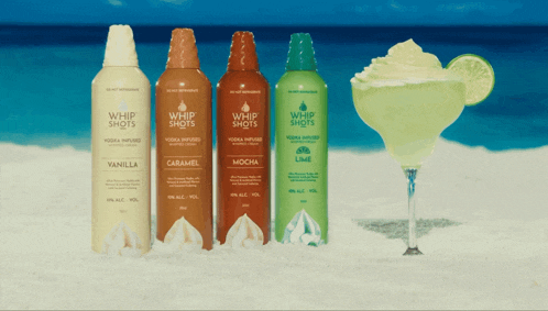 four bottles of whip shots are lined up next to each other