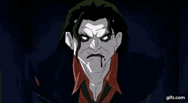 the joker from the batman animated series is making a funny face and smiling .