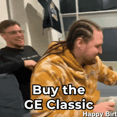 two men are sitting on a couch with the words buy the ge classic happy birt