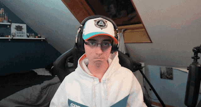a man wearing headphones and a hat that says spf