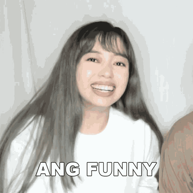 a woman in a white shirt with ang funny written on the bottom