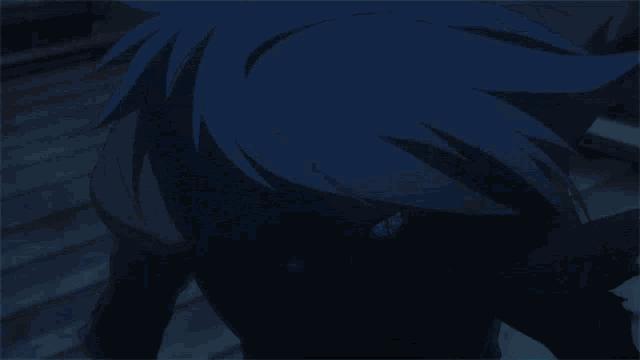 a close up of a person 's face with blue hair