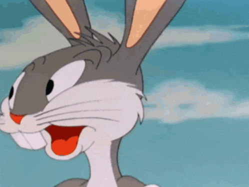 a close up of bugs bunny 's face with his tongue out