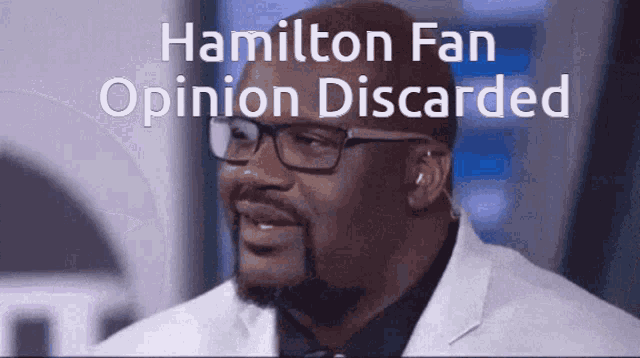 a man wearing glasses and a white jacket with the words hamilton fan opinion discarded above him