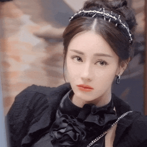 a close up of a woman wearing a headband