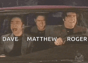three men are laughing in a car with the words dave , matthew , and roger .