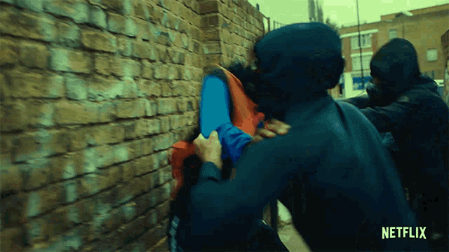 a netflix ad shows a man being attacked by two masked men