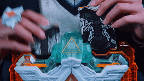 a person is playing with a toy that has the letter a on the front