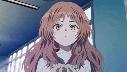 a girl with long red hair and a bow on her neck