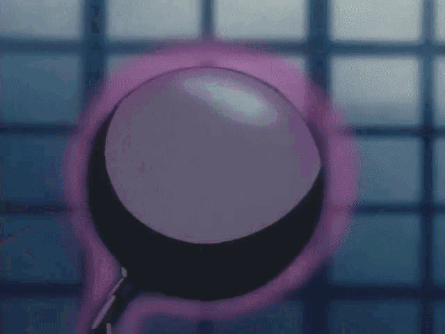 a purple circle with a black circle in the middle of it