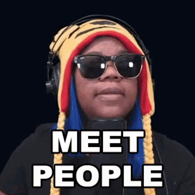 a woman wearing a tiger hat and sunglasses says " meet people "