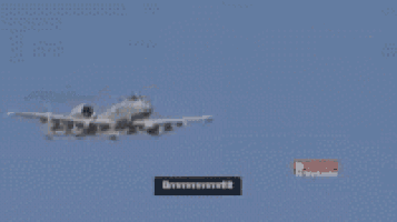 a blurred image of a plane flying in the sky with a sign that says breitenstein