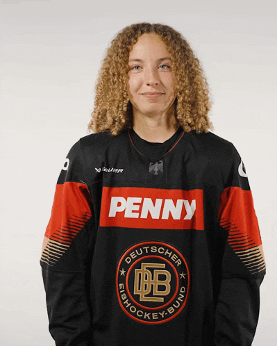 a woman wearing a black and red jersey that says penny on it