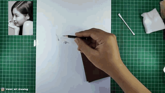 a person is drawing a picture of a girl with a pencil