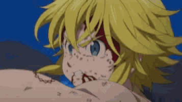a close up of a person 's face with yellow hair and green eyes