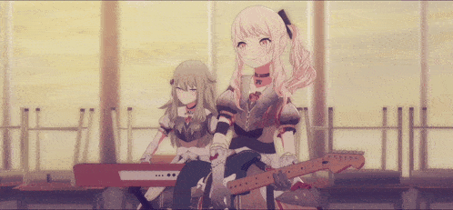 a girl holding a guitar sits next to a girl holding a keyboard