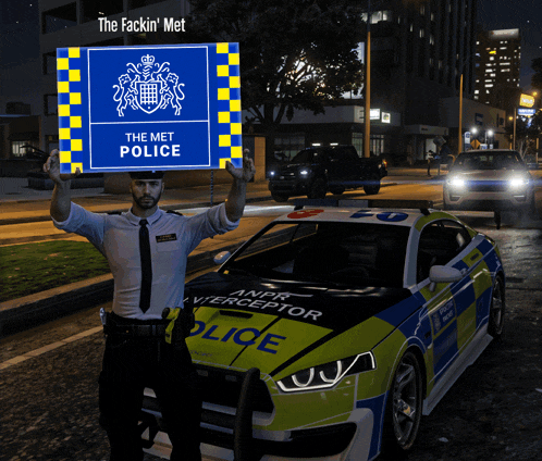 a police officer holds a sign that says the met police