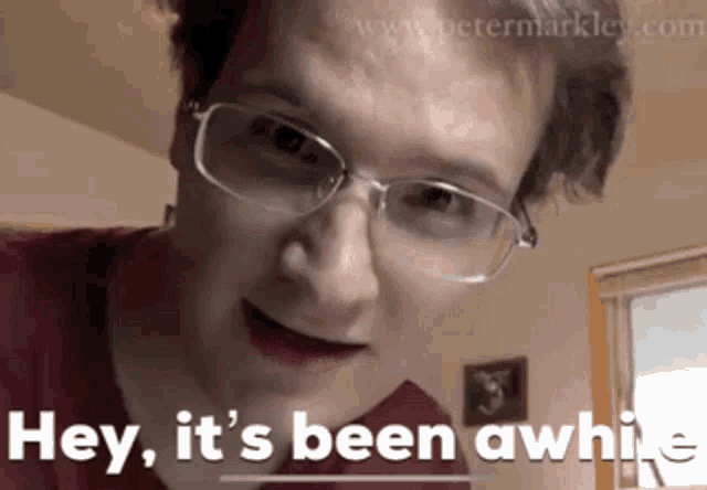 a man wearing glasses says " hey it 's been awwhile "