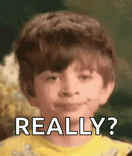 a young boy in a yellow shirt is making a funny face and says `` really '' .