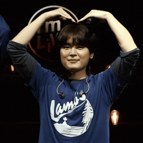 a person wearing a blue shirt that says lamo 's on it