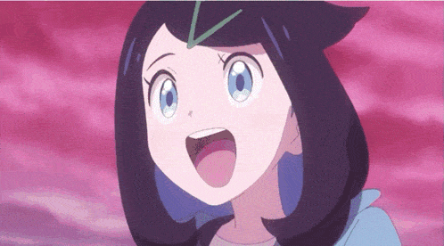 a girl with black hair and blue eyes is smiling