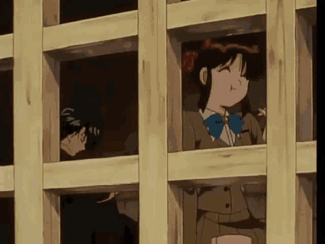 a man and a girl are looking out of a wooden window .