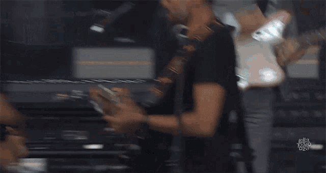 Rocking Out Guitarists GIF - Rocking Out Guitarists Performing GIFs