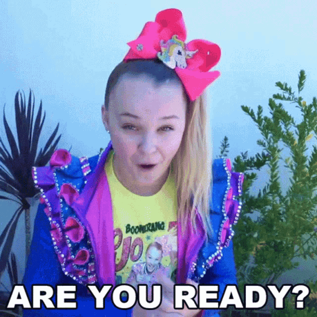 a girl with a pink bow in her hair is asking if she is ready