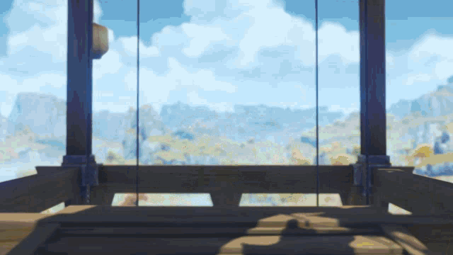 a wooden structure with a view of a landscape in the background