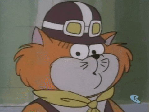 a cartoon cat wearing a helmet and goggles .
