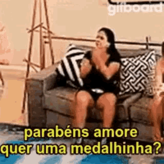 a woman is sitting on a couch with her legs crossed and a phrase in a foreign language .
