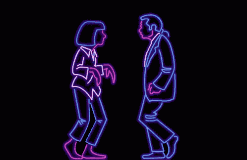 a neon sign of a man and woman dancing together .