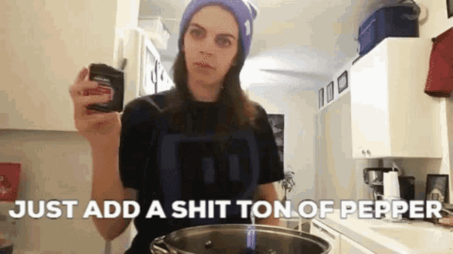 a woman in a kitchen with the words just add a shit ton of pepper behind her