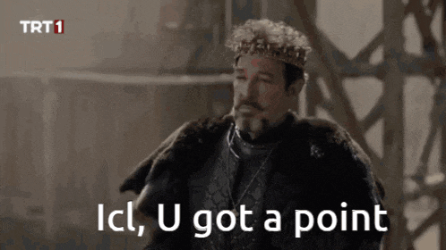 a man wearing a crown and a fur coat says " ici , u got a point "