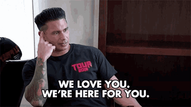 a man in a tour shirt says we love you