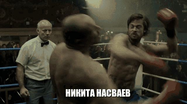 a man in a boxing ring with the word nikita on the bottom right