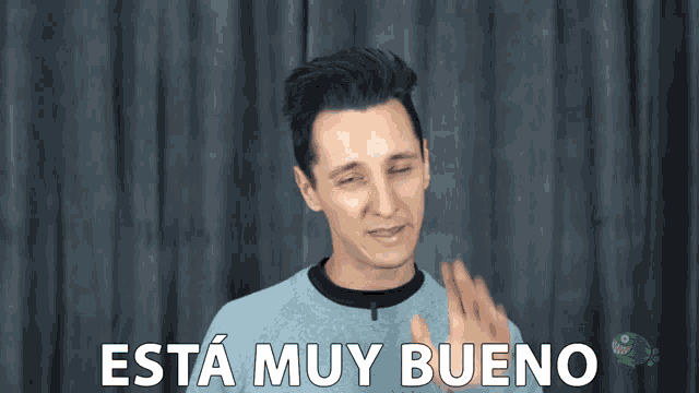 a man winks and says " esta muy bueno "