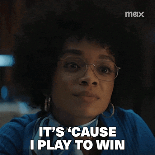 a woman wearing glasses is saying it 's cause i play to win