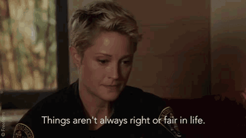 a woman in a police uniform says things aren 't always right or fair in life
