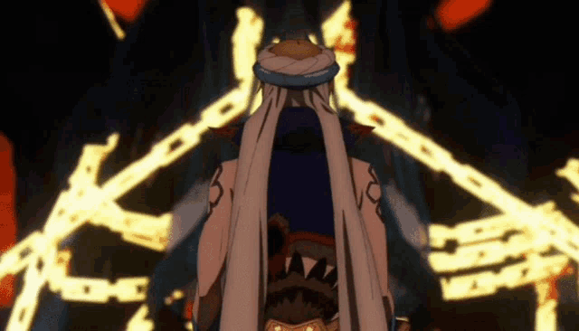 a man in a turban is standing in front of a circle of fire
