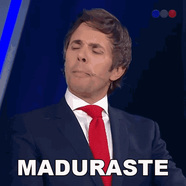 a man in a suit and tie is making a face and the word maduraste is behind him