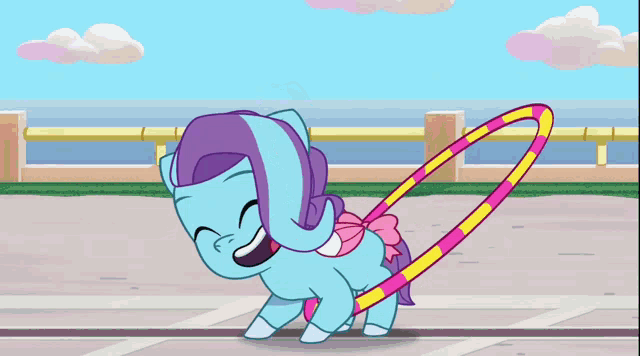 a cartoon pony playing with a hula hoop