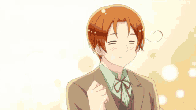 a man in a suit and tie is holding his hands together