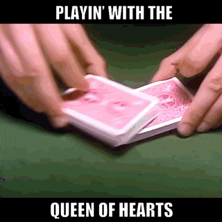 a person is playing a game of queen of hearts with playing cards
