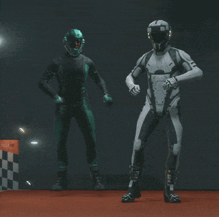 a man in a racing suit is standing next to another man in a green suit