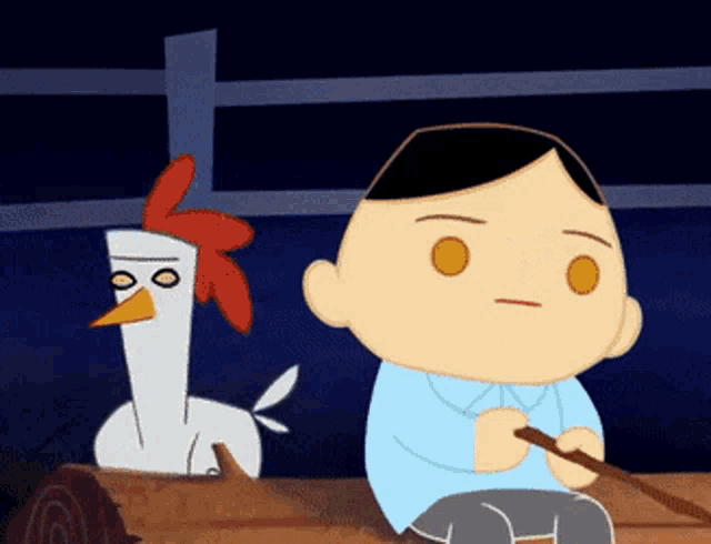 a man sits on a log next to a chicken