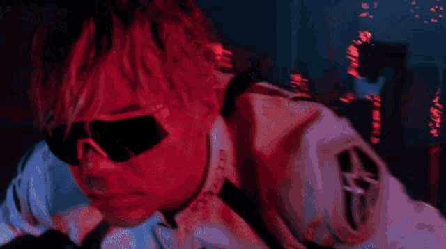a close up of a person wearing sunglasses and a jacket that says ' o'neill ' on it