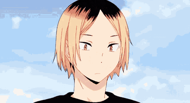 a close up of a person 's face against a blue sky with clouds