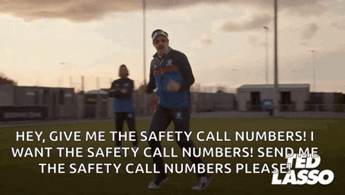 a man is running on a field and says hey give me the safety call numbers !