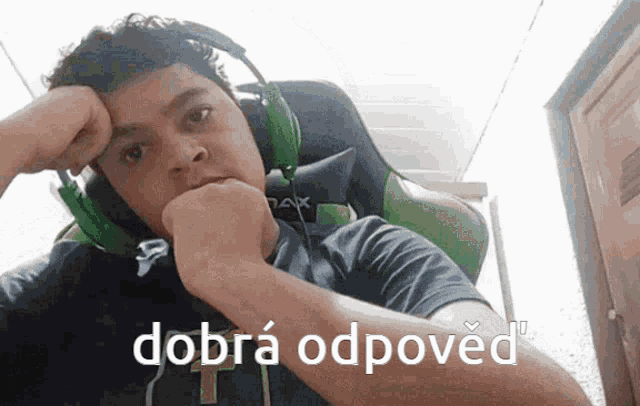 a man wearing headphones with the word dobra on the bottom right